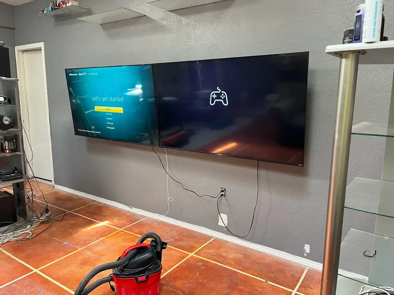 Two TVs wall mounted side by side for gaming and streaming