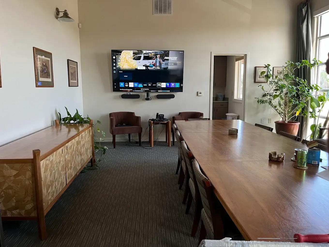 TV and soundbar wall mounted in office conference room